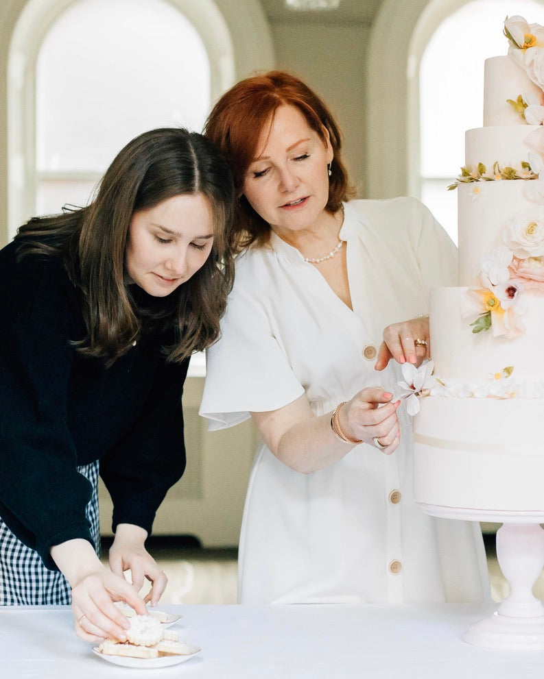 Sugar Nursery Cake Shop Amanda and Maddy decorating a wedding cake