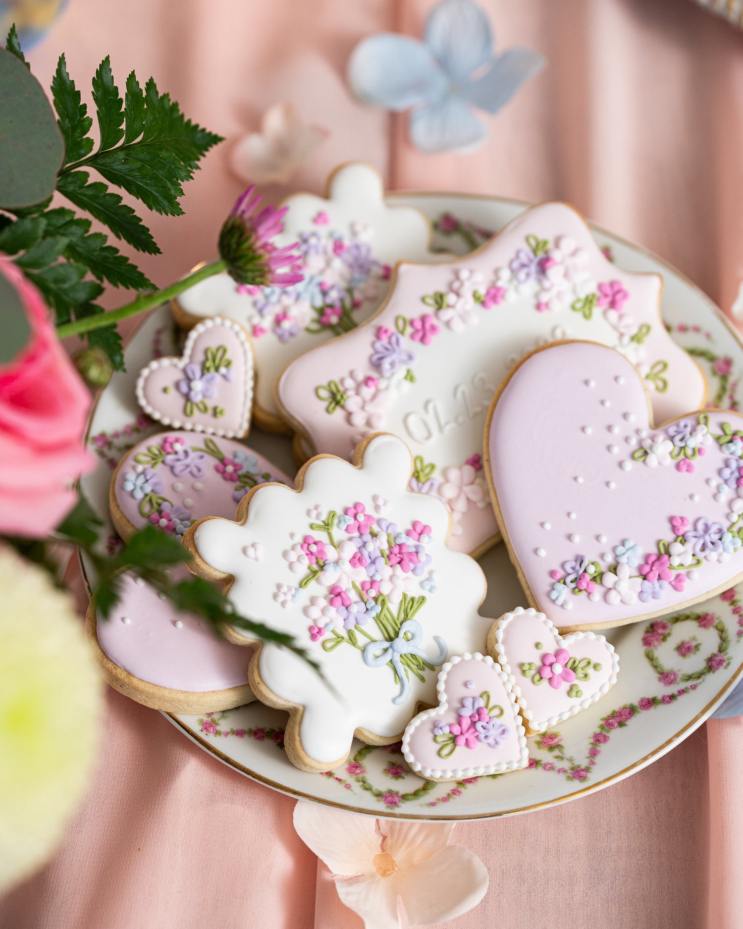 lavender pink and blue floral decorated sugar cookies for wedding sweet table in halifax by sugar nursery