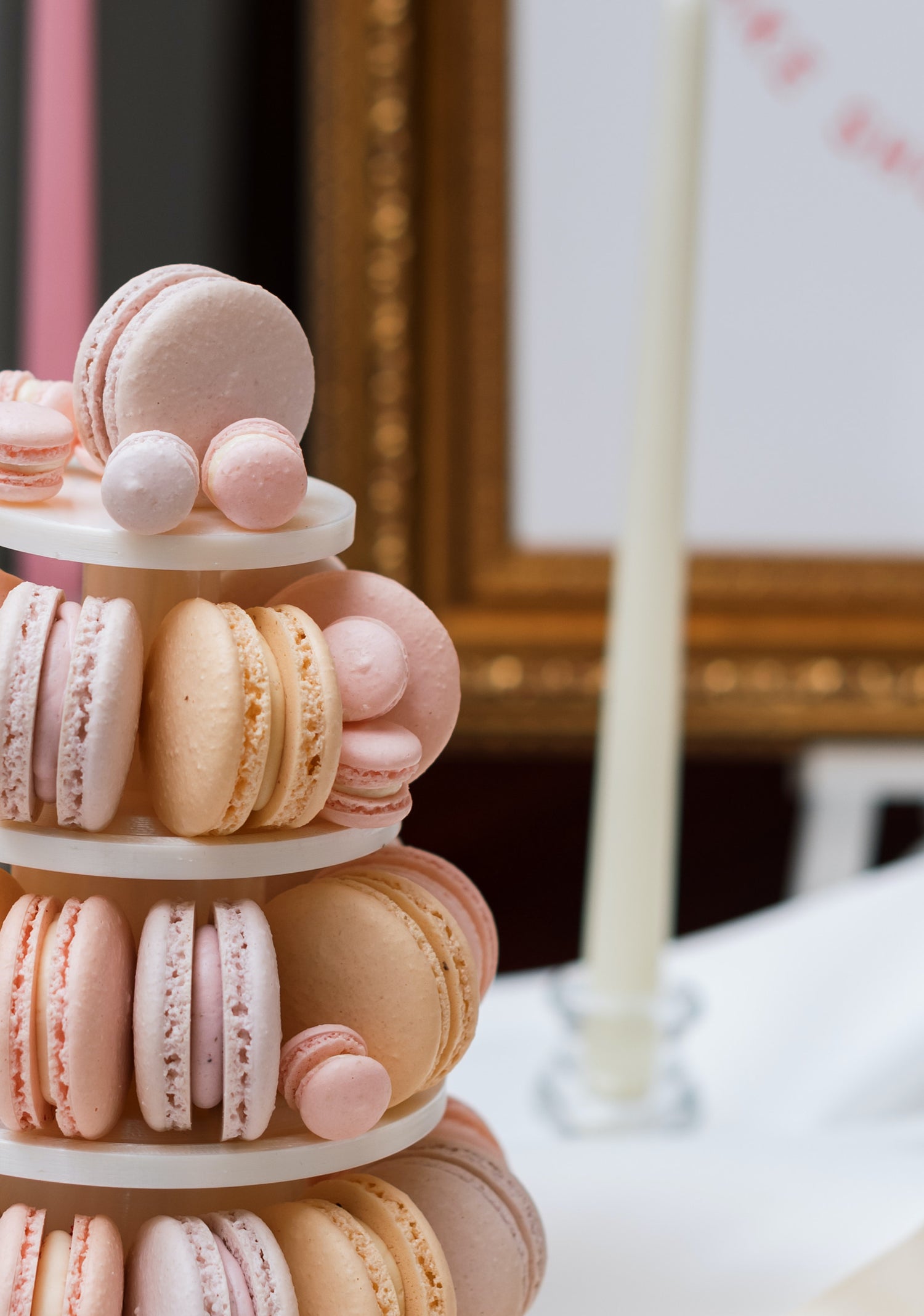 mini macarons in pastel colours on macaron tower for sweet dessert table