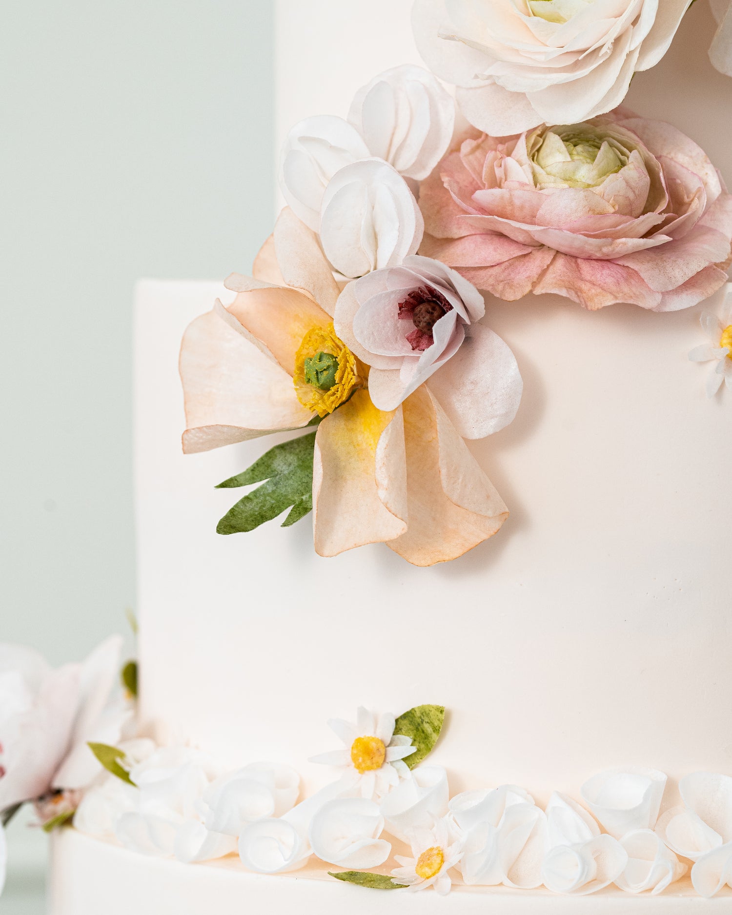 wafer paper ruffles on peach pink garden theme wedding cake by sugar nursery in nova scotia
