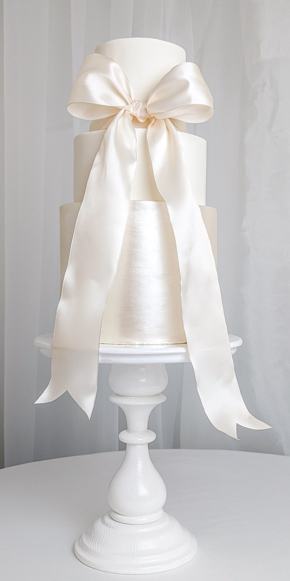 shimmer white cream wedding cake three tiers simple minimal elegant bow halifax nova scotia
