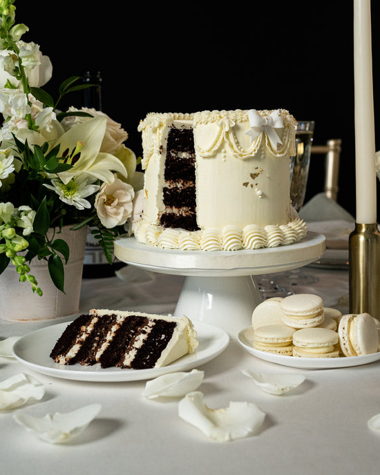 chocolate cake with vanilla buttercream cake and macarons for sweet table wedding in halifax
